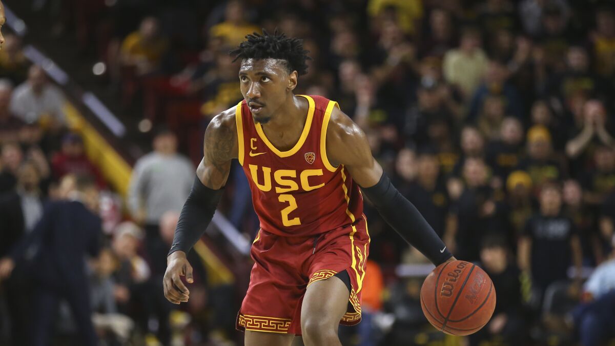 USC guard Jonah Mathews dribbles the ball against Arizona State during the first half of a game Feb. 8, in Tempe, Ariz. Arizona State defeated USC 66-64.