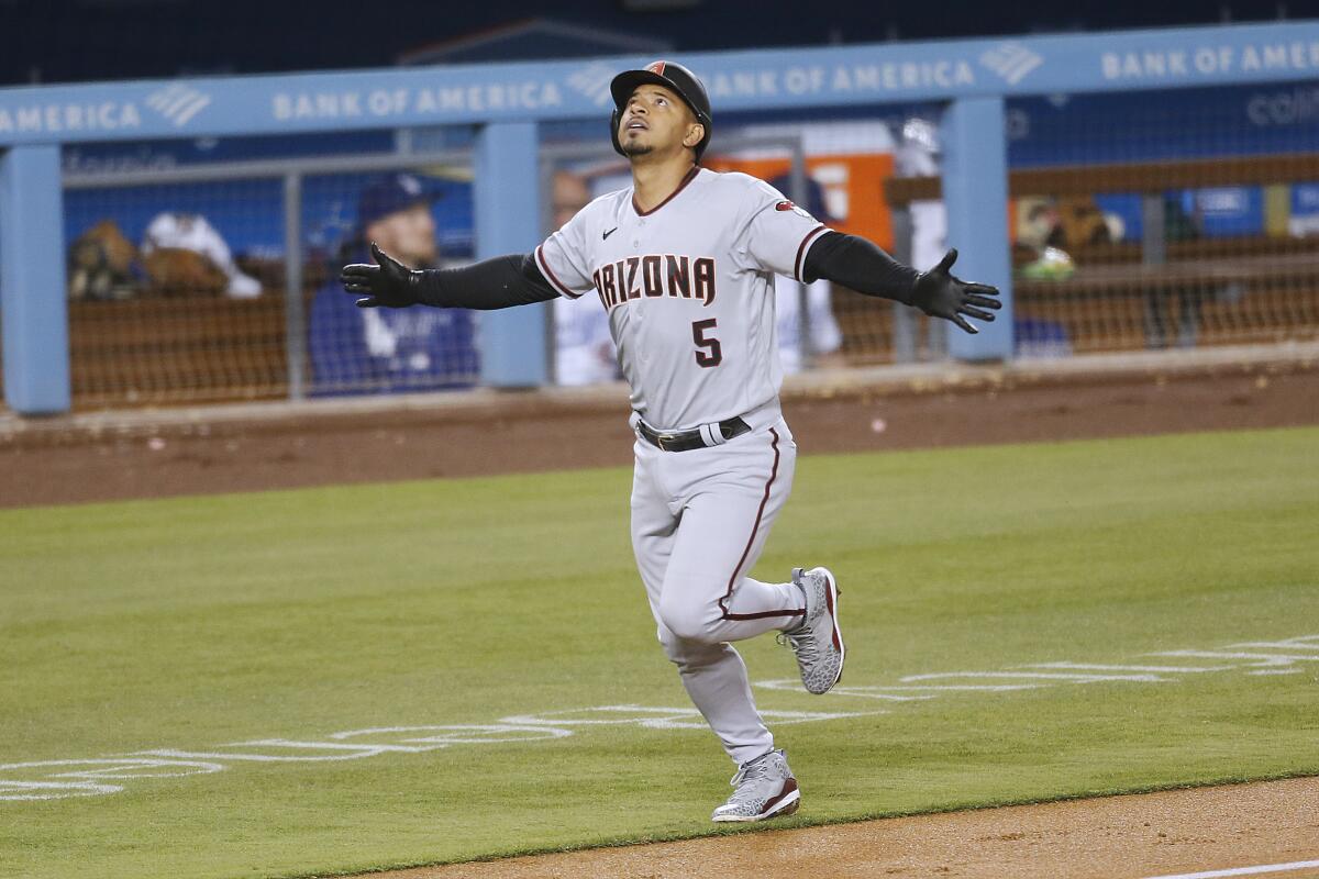 Arizona Diamondbacks Eduardo Escobar celebrates after hitting a home run off Los Angeles Dodgers relief pitcher Joe Kelly 