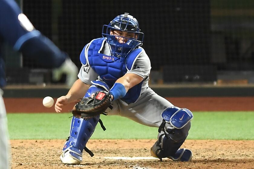 ARLINGTON, TEXAS OCTOBER 24, 2020-Dodgers catcher Will Smith drops the ball allowing the Rays.