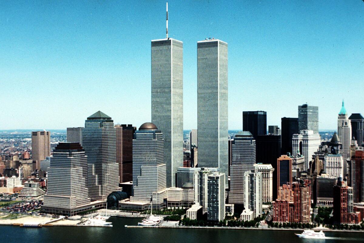 A 1990 photo shows the New York waterfront with the Twin Towers towering above every other building