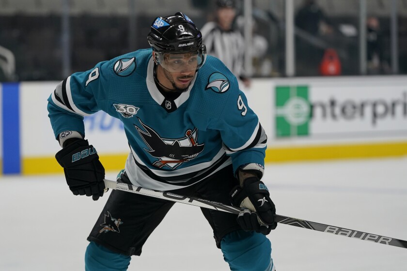 FILE - In this May 12, 2021, file photo, San Jose Sharks' Evander Kane (9) looks on during an NHL hockey game against the Vegas Golden Knights in San Jose, Calif. The Sharks have placed Kane on unconditional waivers on Saturday, Jan. 8, 2022, with the intent to terminate the remainder of his $49 million, seven-year contract. (AP Photo/Jeff Chiu, File)
