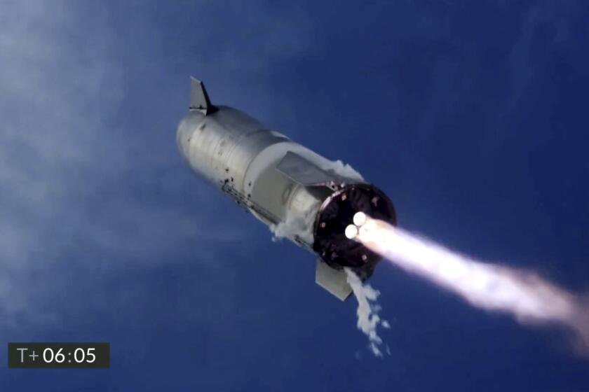 In this image from video made available by SpaceX, one of the company's Starship prototypes fires its thrusters as it lands during a test in Boca Chica, Texas, on Wednesday, March 3, 2021. The two previous attempts ended in explosions. (SpaceX via AP)