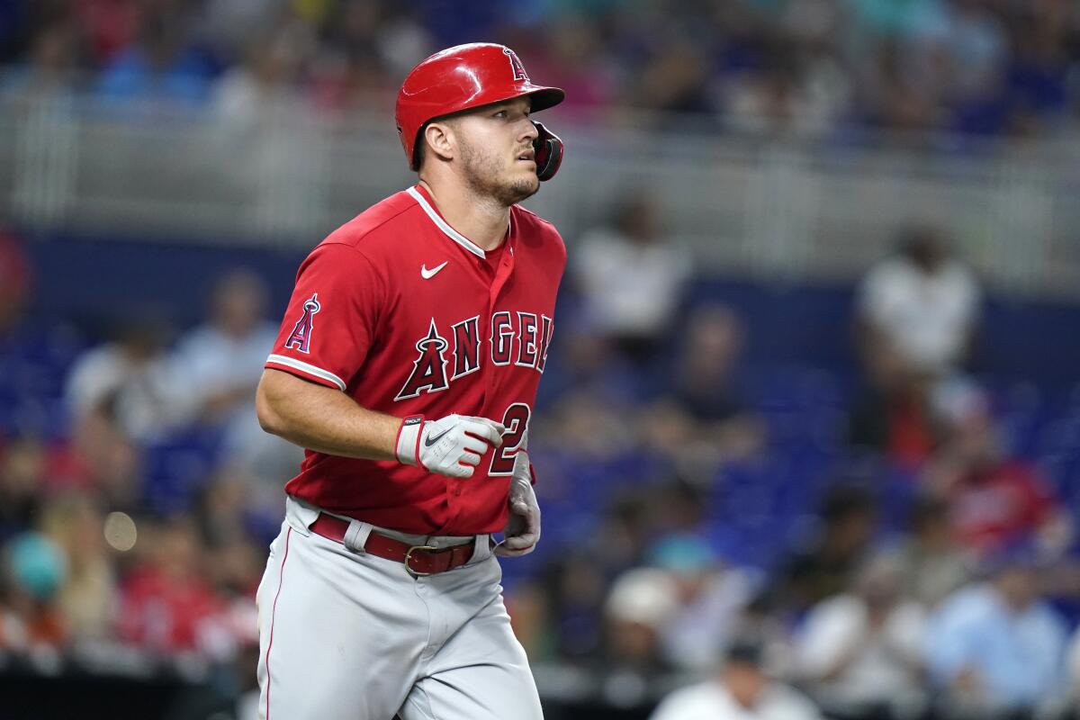 The Angels' Mike Trout draws a walk during the ninth inning against the Miami Marlins Tuesday.