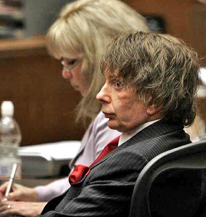 Phil Spector observes the jurors as Judge Larry Paul Fidler polls each one after the jury announced it was deadlocked.