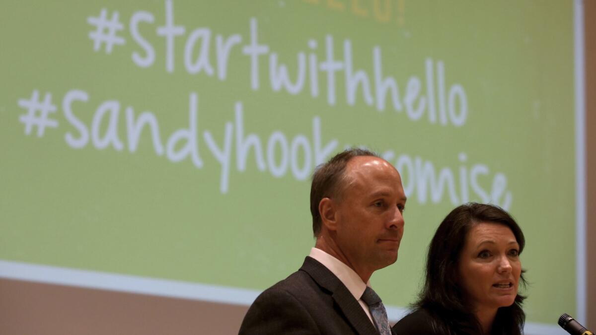 Mark Barden and Nicole Hockley, founders of the Sandy Hook Promise, talk to students at Eagle Rock Junior/Senior High School about how to prevent school violence.