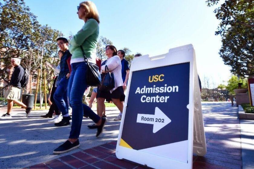 Adults and prospective students tour the University of Southern California (USC) in Los Angeles, California on March 13, 2019. - Thirteen people, including Hollywood Stars and people with ties to UCLA and the University of Southern California (USC) were among more than 50 people arrested on March 12 in a college entrance exam scheme involving wealthy parents and elite universities. "Desperate Housewives" star Felicity Huffman and fellow Hollywood actress Lori Loughlin were among dozens indicted on March 12, 2019 in a multi-million dollar scam to help children of the American elite cheat their way into top universities, including USC. (Photo by Frederic J. BROWN / AFP)FREDERIC J. BROWN/AFP/Getty Images ** OUTS - ELSENT, FPG, CM - OUTS * NM, PH, VA if sourced by CT, LA or MoD **
