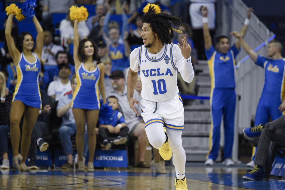UCLA guard Tyger Campbell celebrates after making a three-point shot during the second half against Utah on Sunday at Pauley Pavilion.
