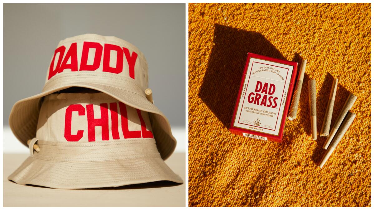 Two beige bucket hats with red lettering that reads "Daddy Chill" next to a box and five prerolled hemp joints.