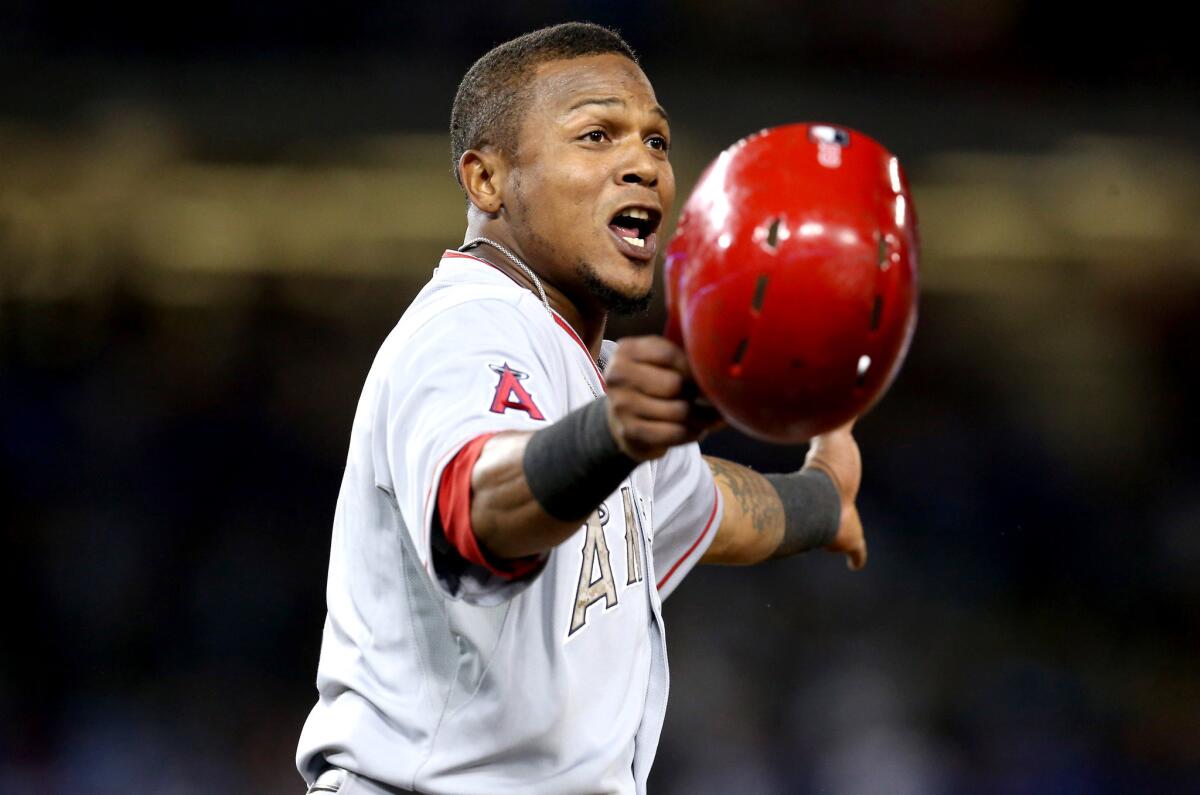 Angels' Erick Aybar argues after being tagged out in the eighth inning against the Dodgers.
