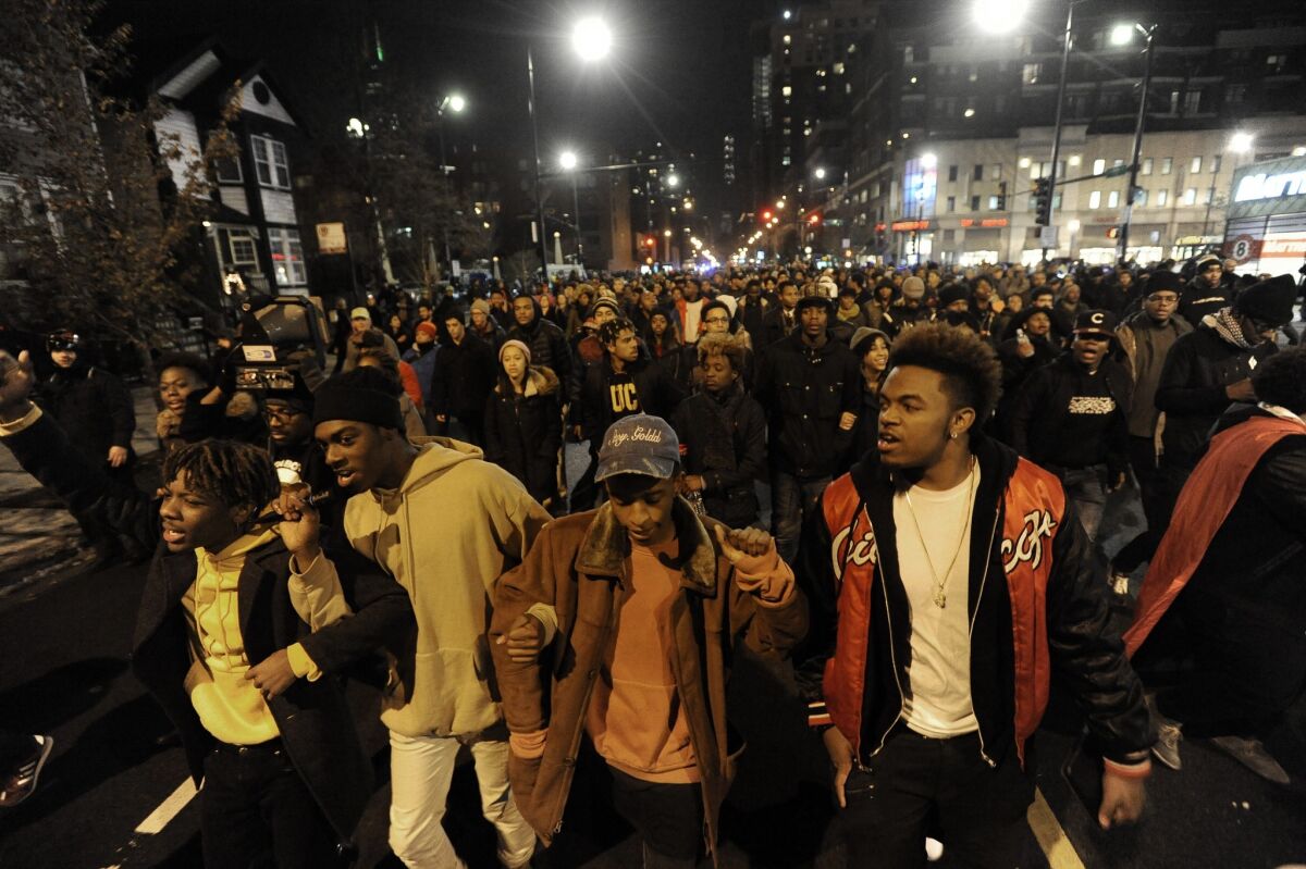 Protesters march during a protest for 17-year-old Laquan McDonald, who was fatally shot and killed in October 2014 in Chicago. Chicago Police Officer Jason Van Dyke was charged Nov. 24, 2015, with first-degree murder in the killing.