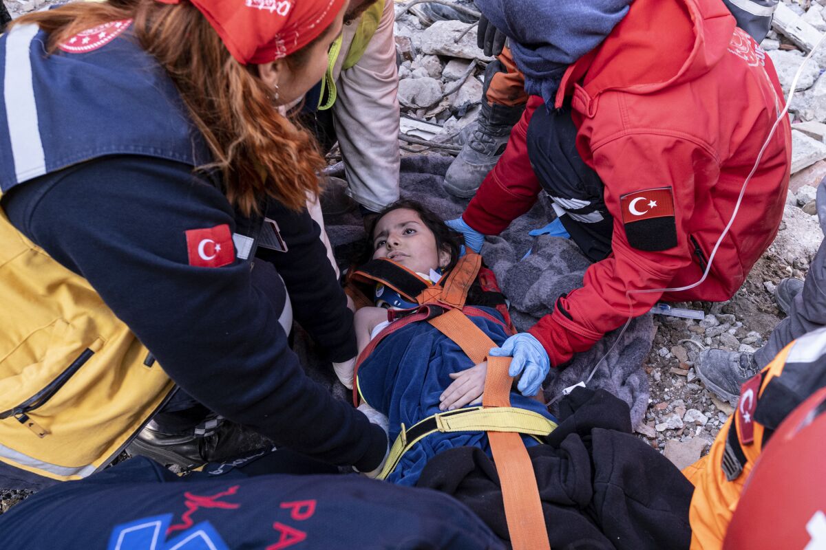 Rescue crews pulling survivor from collapsed building in Antakya, Turkey