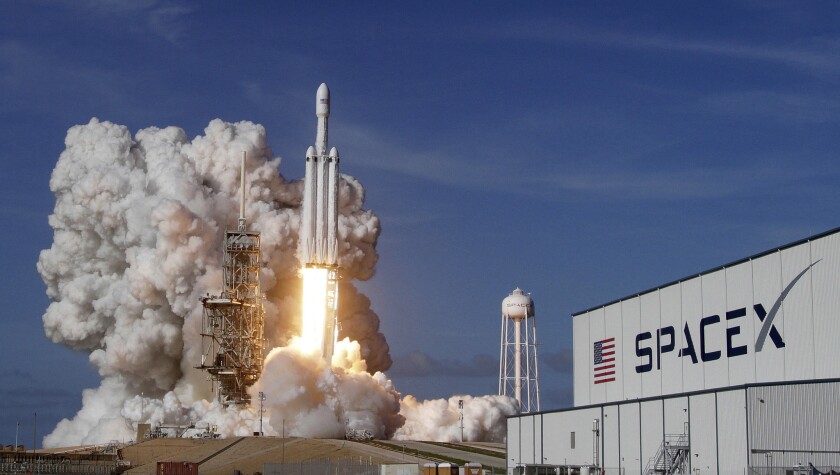 SpaceX's Falcon Heavy rocket lifts off from Kennedy Space Center in Florida last year. The rocket is set to launch its first commercial mission Wednesday.