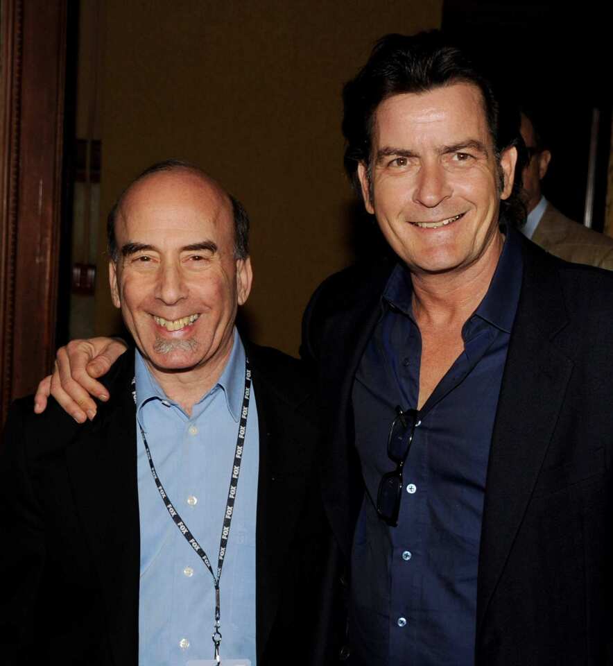 Charlie Sheen, right, and "Anger Management" executive producer Bruce Helford commiserate at Fox's party for the Television Critics Assn. media tour Sunday, Jan. 8, at Castle Green in Pasadena. "I'm not crazy anymore," Sheen told reporters. "That was an episode. I'm a different person than I was yesterday!"