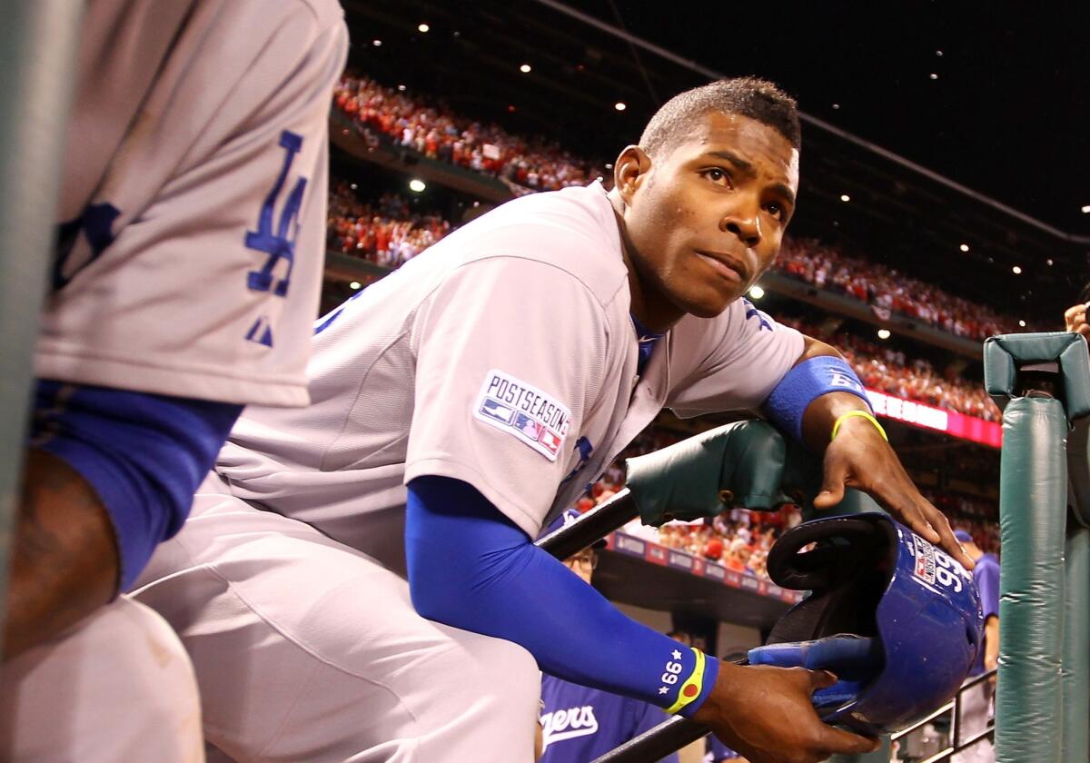 Yasiel Puig looks on from the dugout after the Dodgers were eliminated from the postseason by the St. Louis Cardinals in the National League Division Series on Oct. 7.