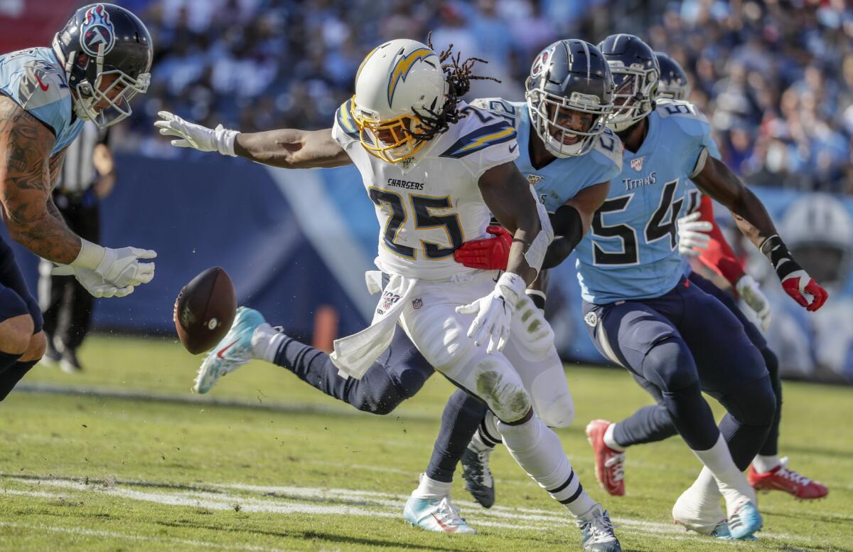 Chargers running back Melvin Gordon fumbles the ball.
