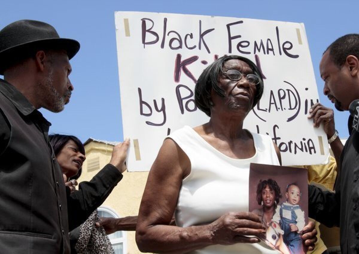 Ada Moses holds a photo of her granddaughter, Alesia Thomas, and Moses' great granddaughter. Thomas died last year after being arrested by LAPD officers, including Mary O'Callaghan, 48, who has been charged in the incident.