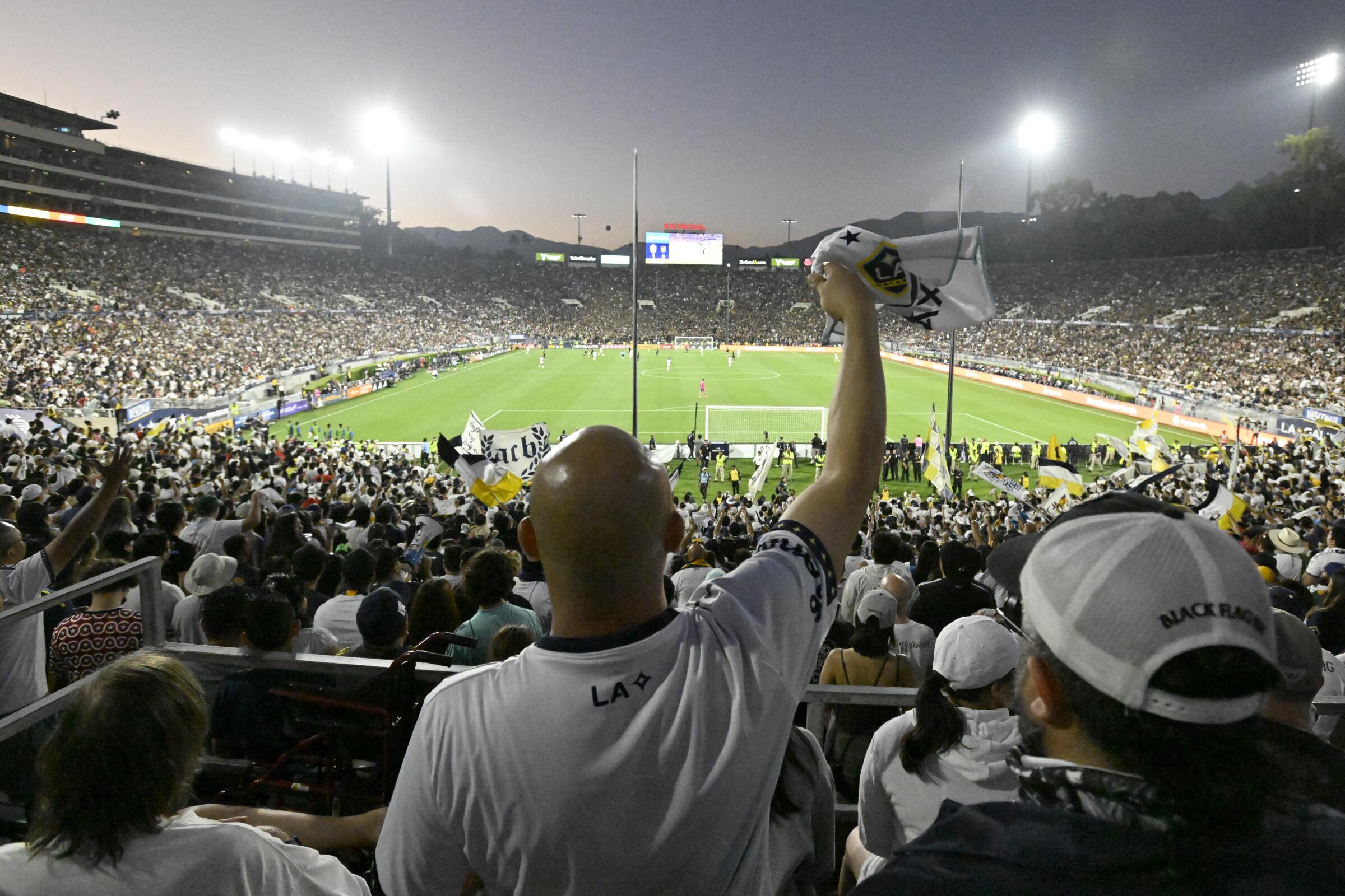 Galaxy fans cheer during a game against LAFC at the Rose Bowl in July 2023.