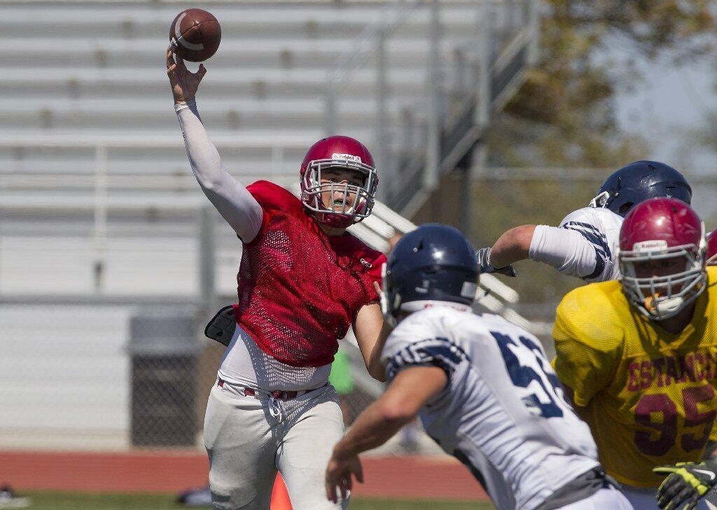 Estancia High quarterback Connor Brown throws the ball during a scrimmage against Newport Harbor at Jim Scott Stadium on Friday.