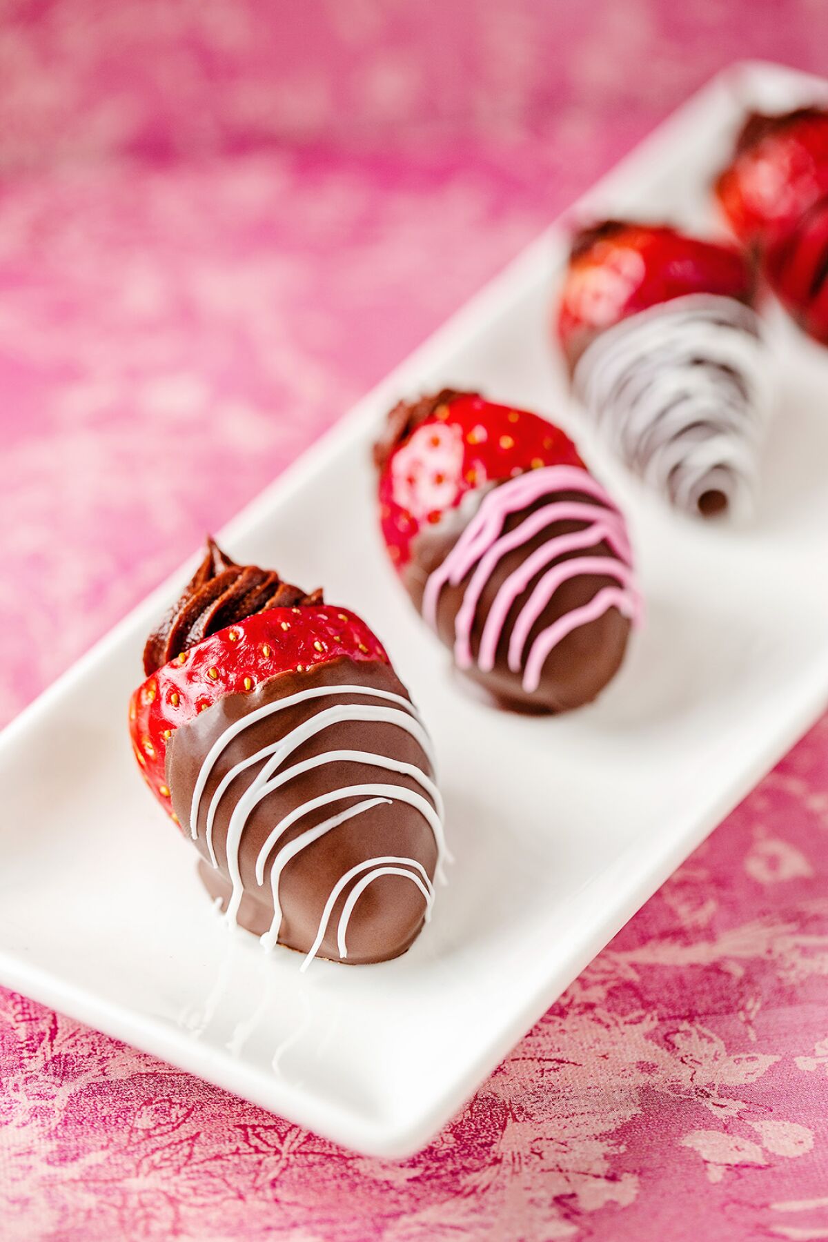 Chocolate-dipped strawberries stuffed with chocolate and Nutella-flavored cream cheese.