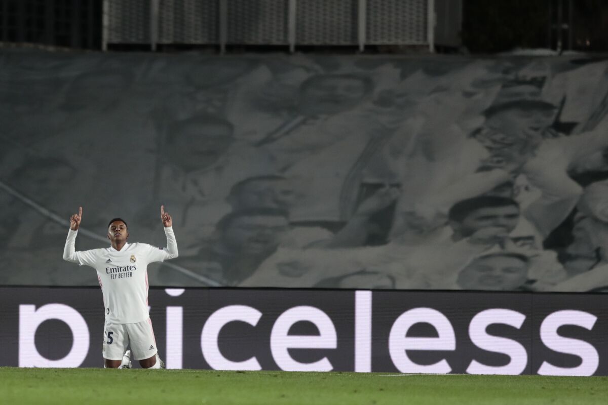 Real Madrid's Rodrigo celebrates after scoring his side's third goal during the Champions League group B soccer match between Real Madrid and Inter Milan at the Alfredo Di Stefano stadium in Madrid, Spain, Tuesday, Nov. 3, 2020. (AP Photo/Bernat Armangue)