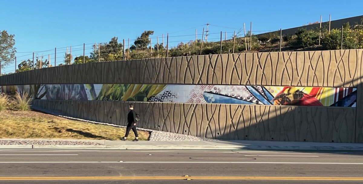 Northwest panel, with bee. A long, colorful collage on a challenging site.