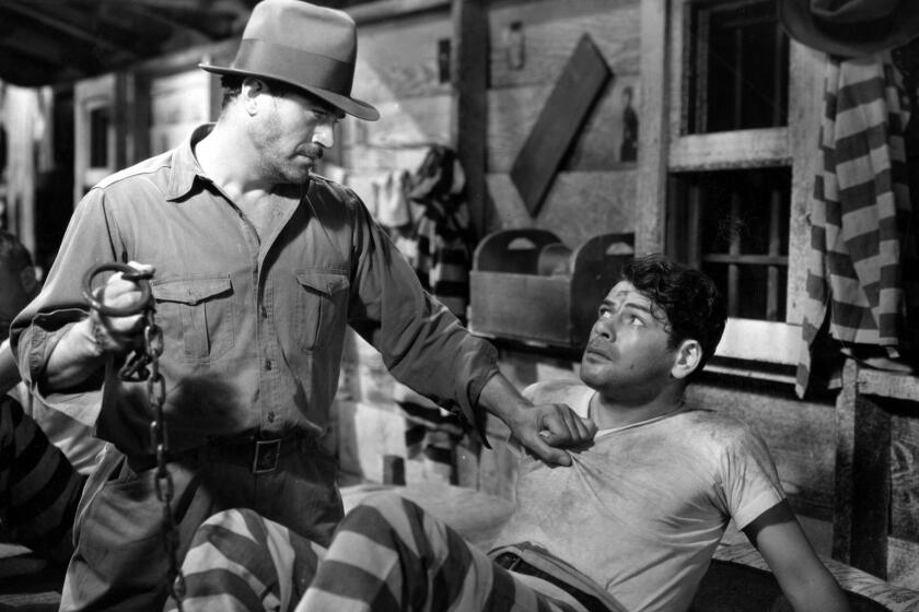 Actor Paul Muni (right) in a scene from the 1932 film "I Am A Fugitive From A Chain Gang."