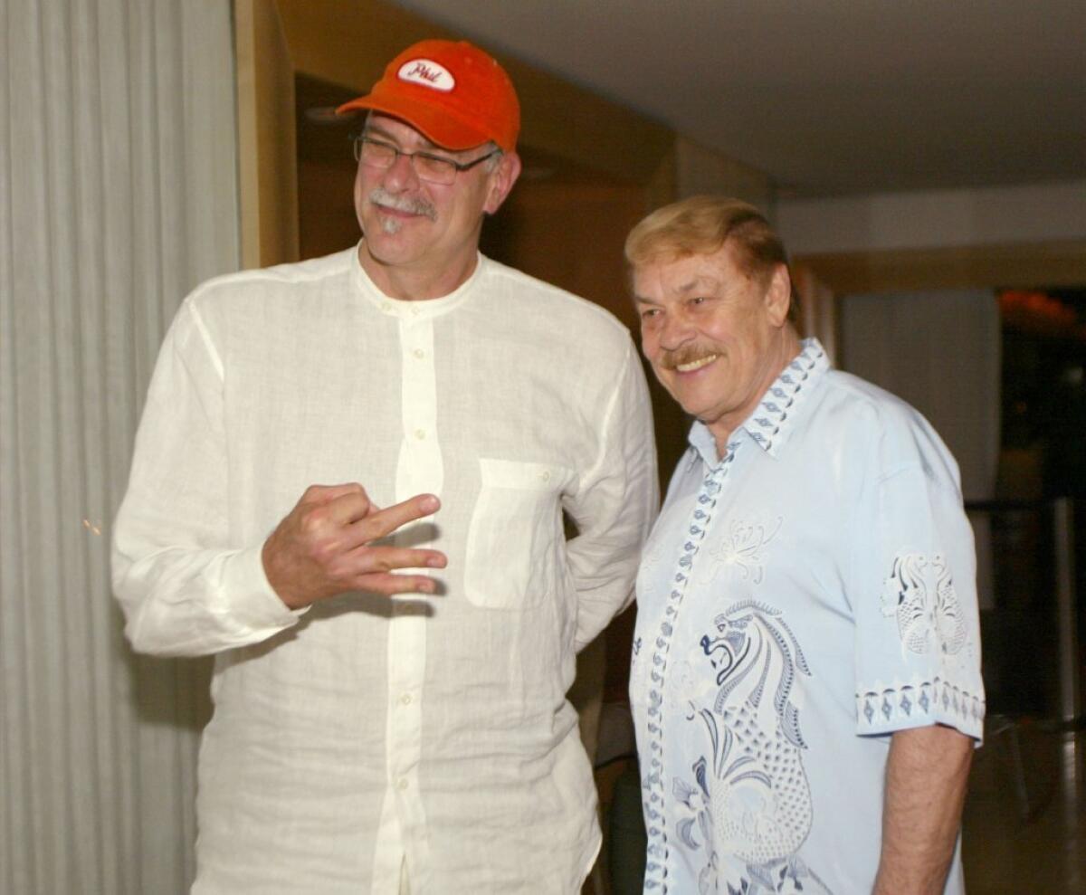 Phil Jackson, shown here with Jerry Buss in 2002, will be one of the speakers at the late Lakers owner's memorial service.