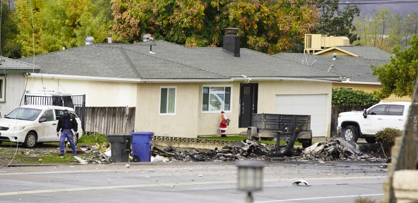 Residents wake up Dec. 28 to debris from Learjet crash a night prior on Pepper Drive in Bostonia neighborhood of East County.