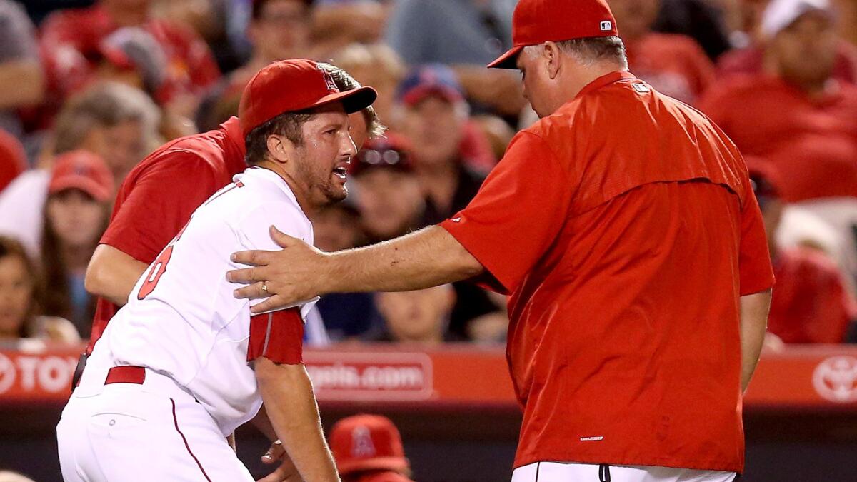 Angels closer Huston Street has trouble standing after injuring his groin in Saturday night's game against the Mariners.