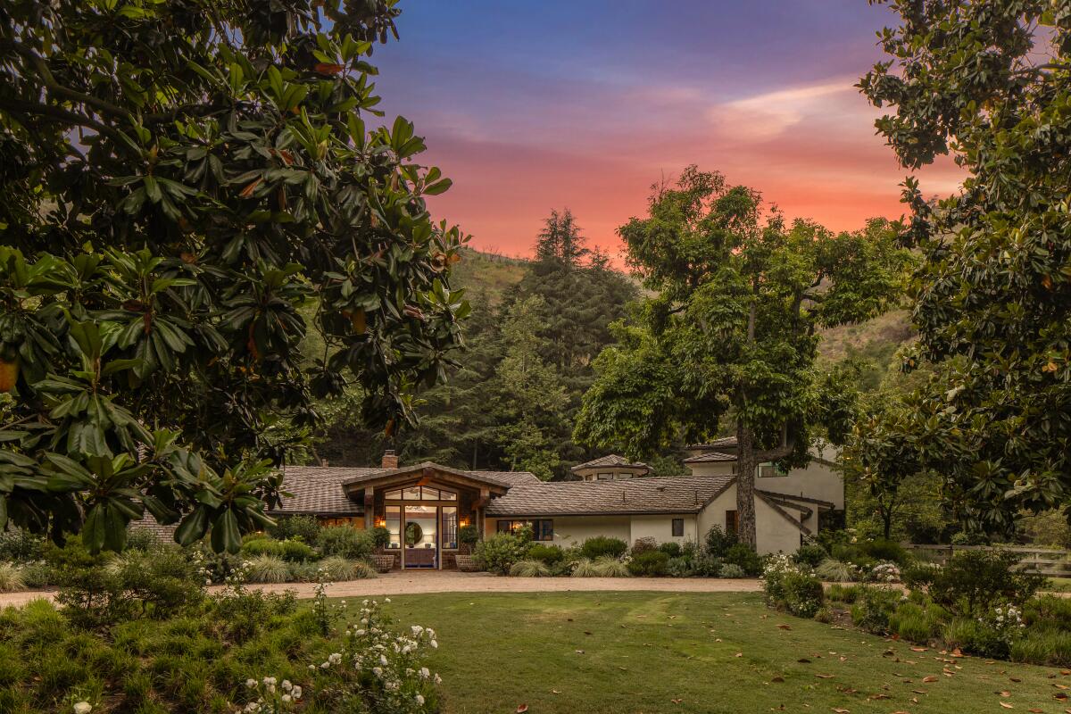 The main house spans 12,000 square feet with seven bedrooms, a dog spa and art studio.
