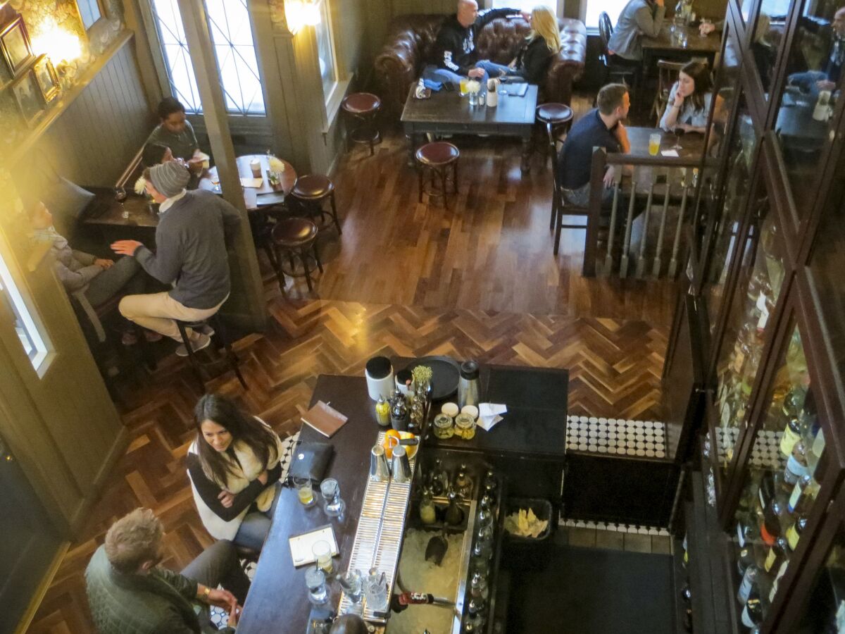 Looking down at the first-floor bar at Half Door Brewing Co. in downtown San Diego, which is housed in a converted home. (Irene Lechowitzky)
