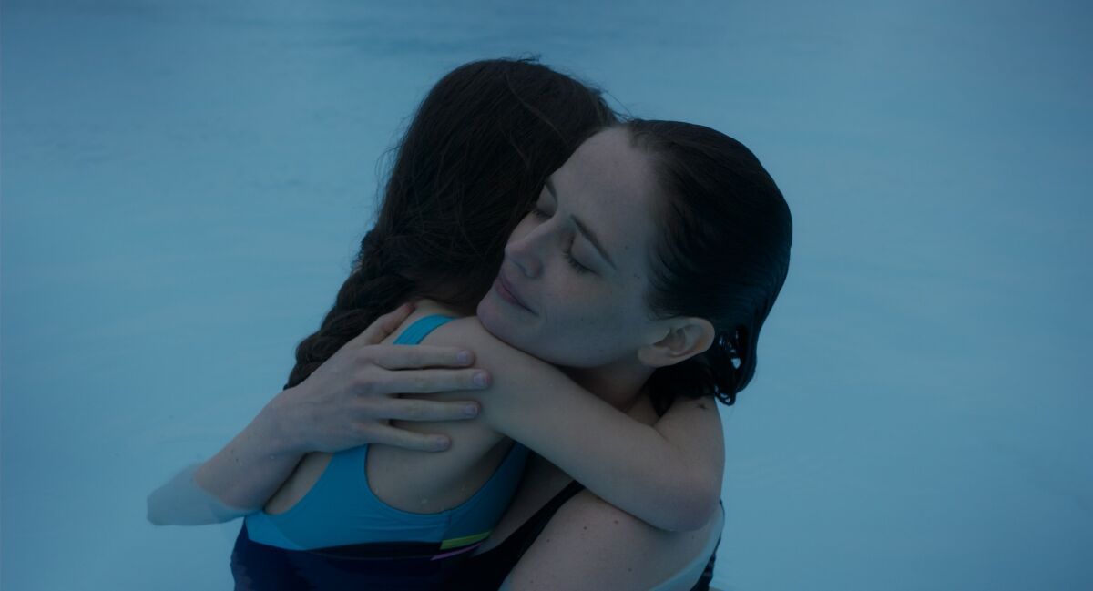 Eva Green, right, and Zélie Boulant-Lemesle in the movie “Proxima.”