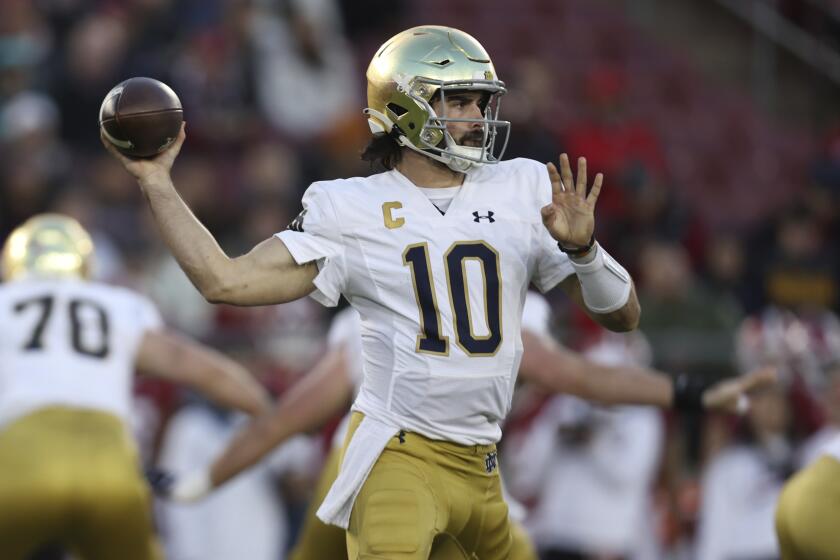 FILE - Notre Dame quarterback Sam Hartman (10) passes during the first half of an NCAA college football game against Stanford in Stanford, Calif., Saturday, Nov. 25, 2023. The Washington Commanders have signed former Notre Dame and Wake Forest quarterback Sam Hartman among 11 undrafted free agents. (AP Photo/Jed Jacobsohn, File)