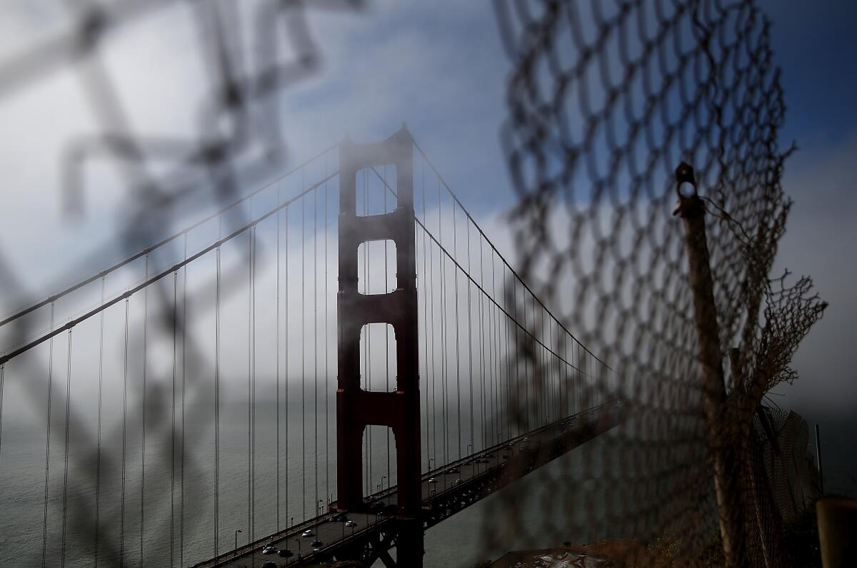 The north tower of the Golden Gate Bridge is viewed through a fence in Sausalito in this 2014 file photo.