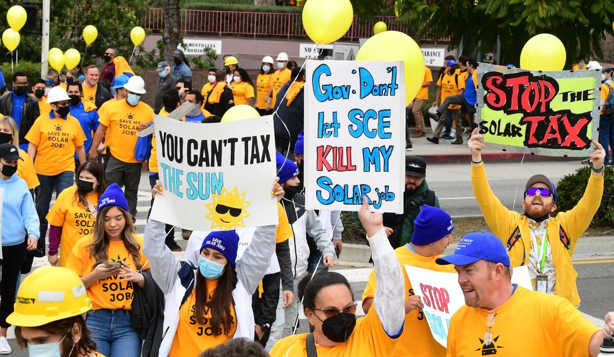 A crowd of over 1,000 solar workers protest in downtown Los Angeles.  