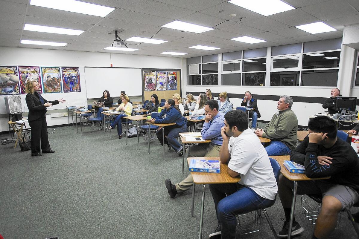 Costa Mesa City Councilwoman and former Newport-Mesa school board member Katrina Foley speaks to parents, athletes, boosters, alumni and coaches at a meeting Monday to discuss the Costa Mesa High School stadium issue.