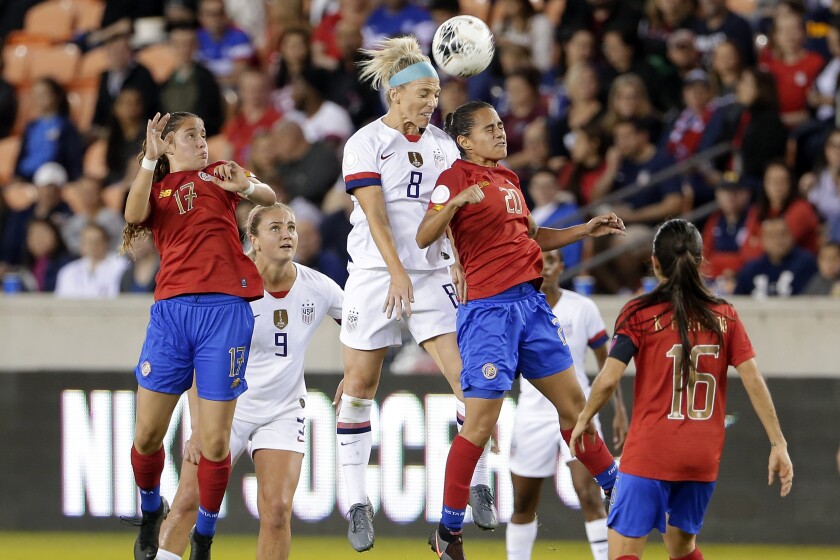 United States midfielder Julie Ertz (8) and Costa Rica midfielder Raquel Chacon (20) collide as they go for a header while Costa Rica forward Maria Salas (17), midfielder Lindsey Horan (9) and midfielder Katherine Alvarado (16) look on during the first half of a CONCACAF women's Olympic qualifying soccer match Monday, Feb. 3, 2020, in Houston. (AP Photo/Michael Wyke)