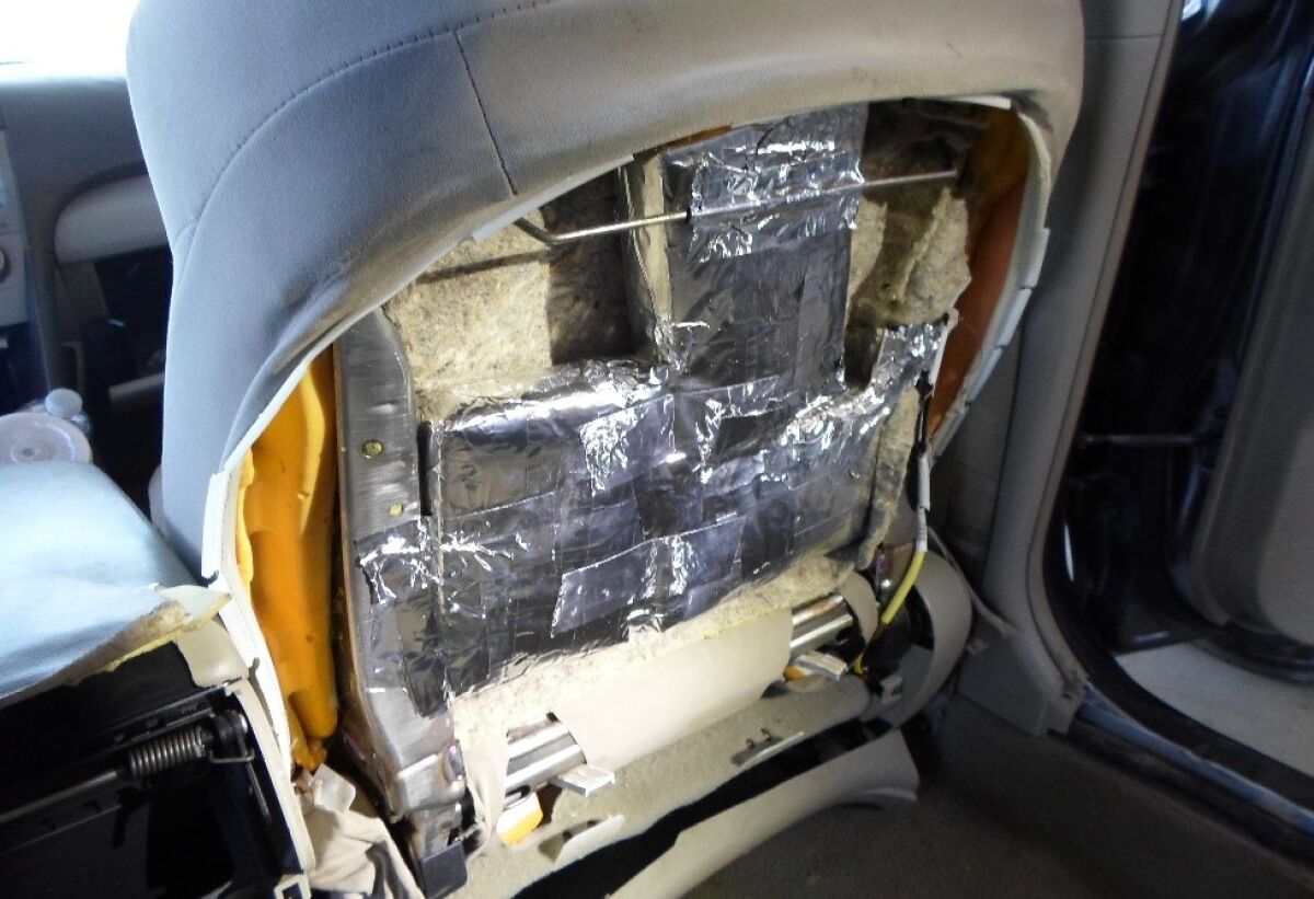 Border Patrol agents found 18 foil packages containing more than 46 pounds of cocaine and fentanyl hidden inside the seats of a car Wednesday on I-15 in Escondido.