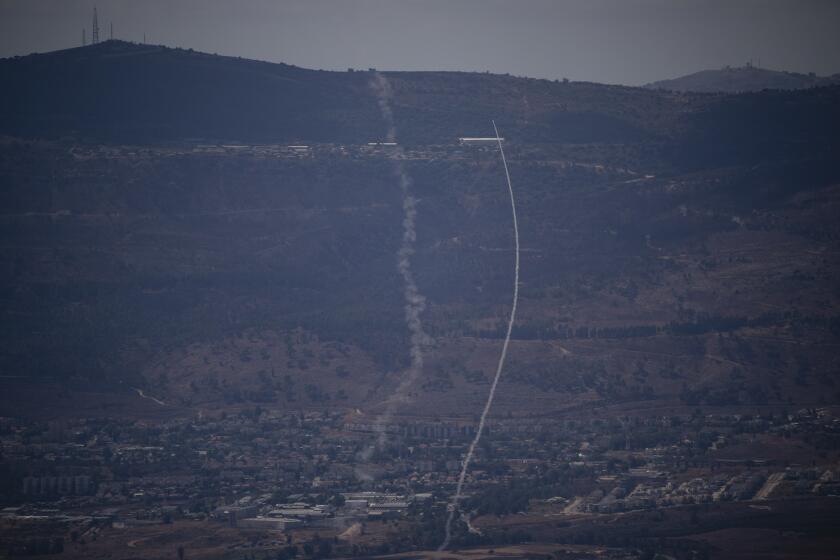 The Israeli Iron Dome air defense system fires to intercept an attack from Lebanon over the Galilee region, near Kiryat Shmona, as seen from the Israeli-annexed Golan Heights, Tuesday, Sept. 17, 2024. (AP Photo/Leo Correa)