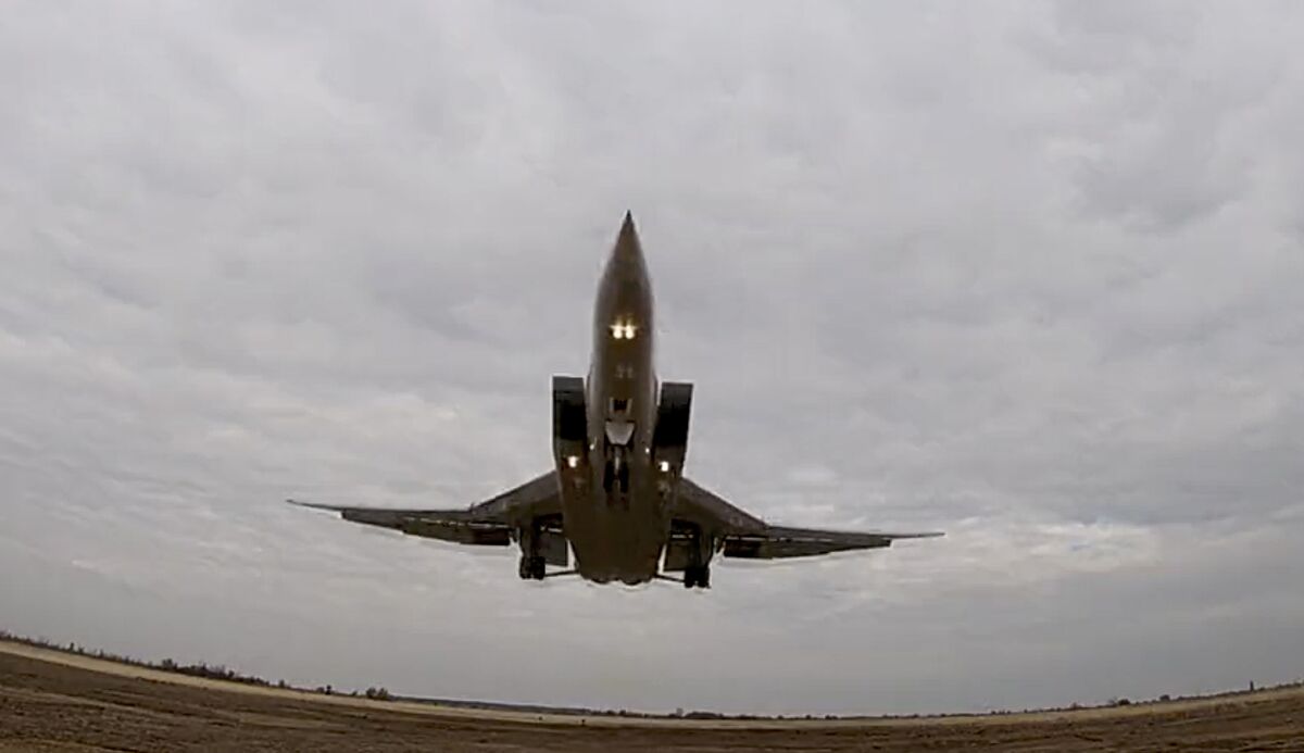In this handout photo taken from video released by Russian Defense Ministry Press Service on Wednesday, Nov. 10, 2021, a long-range Tu-22M3 bomber of the Russian Aerospace Forces takes-off to patrol in the airspace of Belarus, Thursday, Nov. 11, 2021. Russia has sent two nuclear-capable strategic bombers on a training mission over Belarus in a show of Moscow's support for its ally amid a dispute over migration at the Polish border. Russia has supported Belarus amid a tense standoff this week as thousands of migrants gathered on the Belarus-Poland border in hopes of crossing into Europe. (Russian Defense Ministry Press Service via AP)