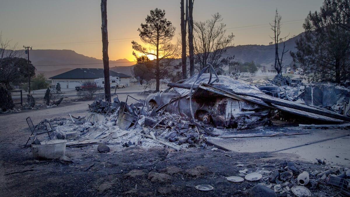 Burned rubble is all that remains of the Kern County home where Byron McKaig, 81, and his wife, Gladys, 90, died trying to escape the Erskine fire.