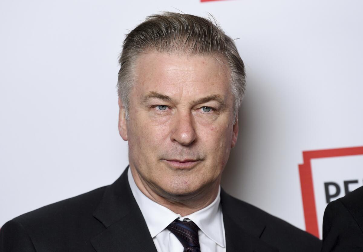 Actor Alec Baldwin in a black suit and tie at a literary gala in 2019.