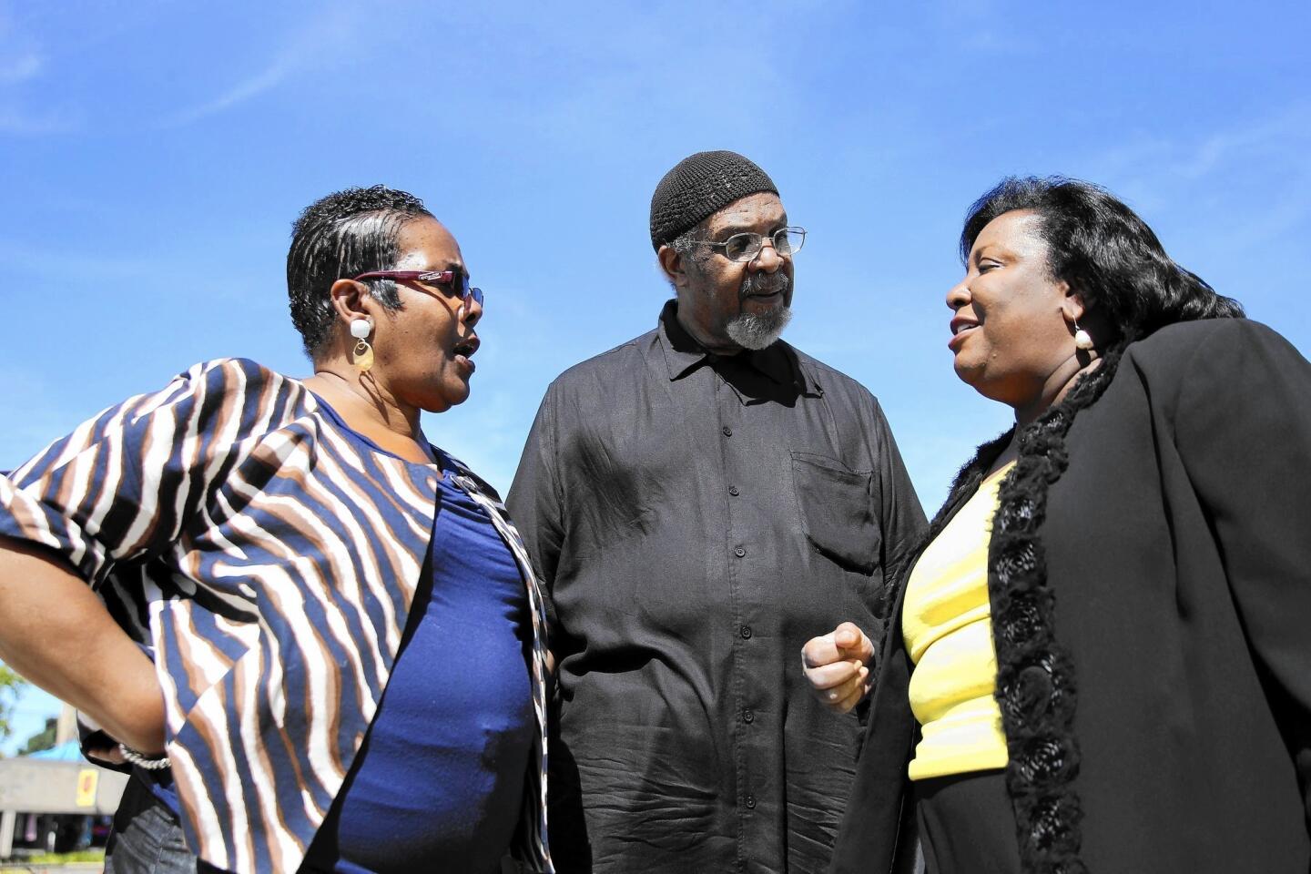State Rep. Esther Golar, left, shown Sept. 14, 2013, with John Bradley and Mildred M.G. Olivier in Chicago. Golar was known for fighting for the disadvantaged and for singing on the House floor. She died Sept. 21 at 71. Read the obituary.