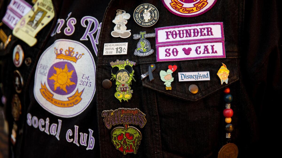 Pins and patches adorn the vest of a Flynn's Riders social club founder. Flynn's Riders is one of about 100 Disneyland social clubs.