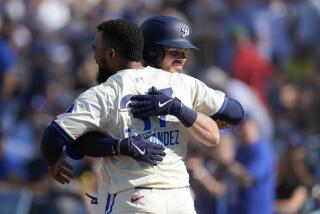 Los Angeles Dodgers' Gavin Lux, right, celebrates after his solo home run with Teoscar Hernández.
