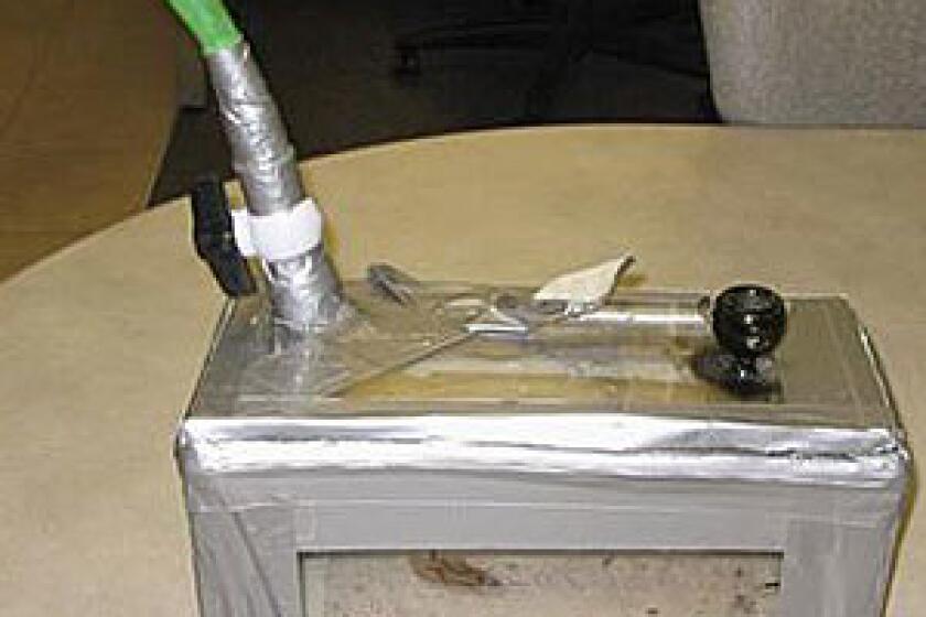 A homemade bong, consisting of a piece of garden hose attached to a duct-taped plexiglas box, is seen in this March 1, 2009, handout photo provided by the Lancaster County Sheriff's Dept.