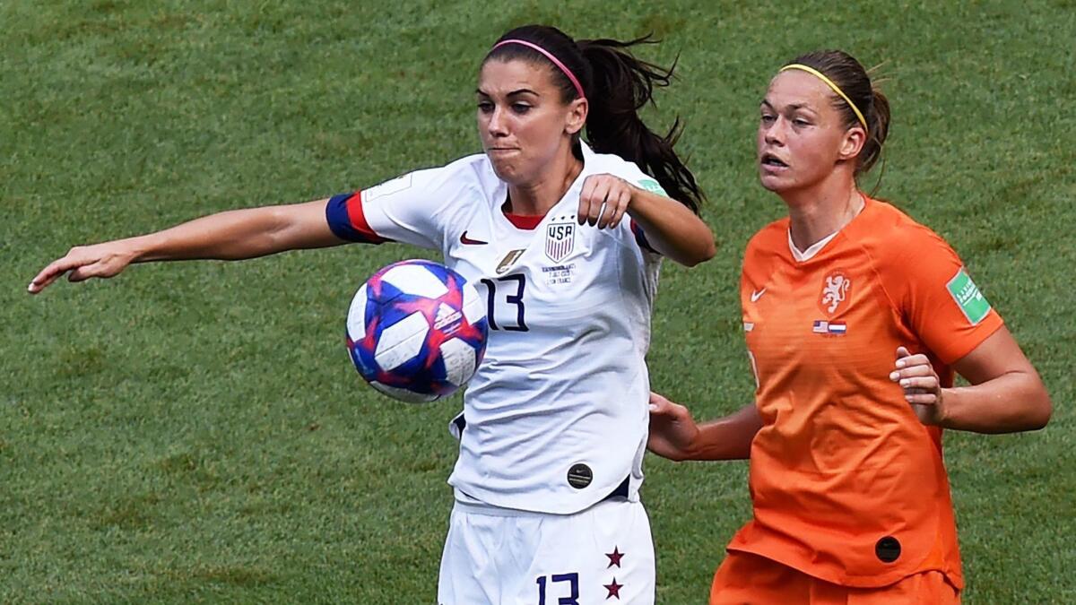U.S. forward Alex Morgan, left, and Netherlands' defender Anouk Dekker battle for the ball during the first half of the Women's World Cup final on Sunday.