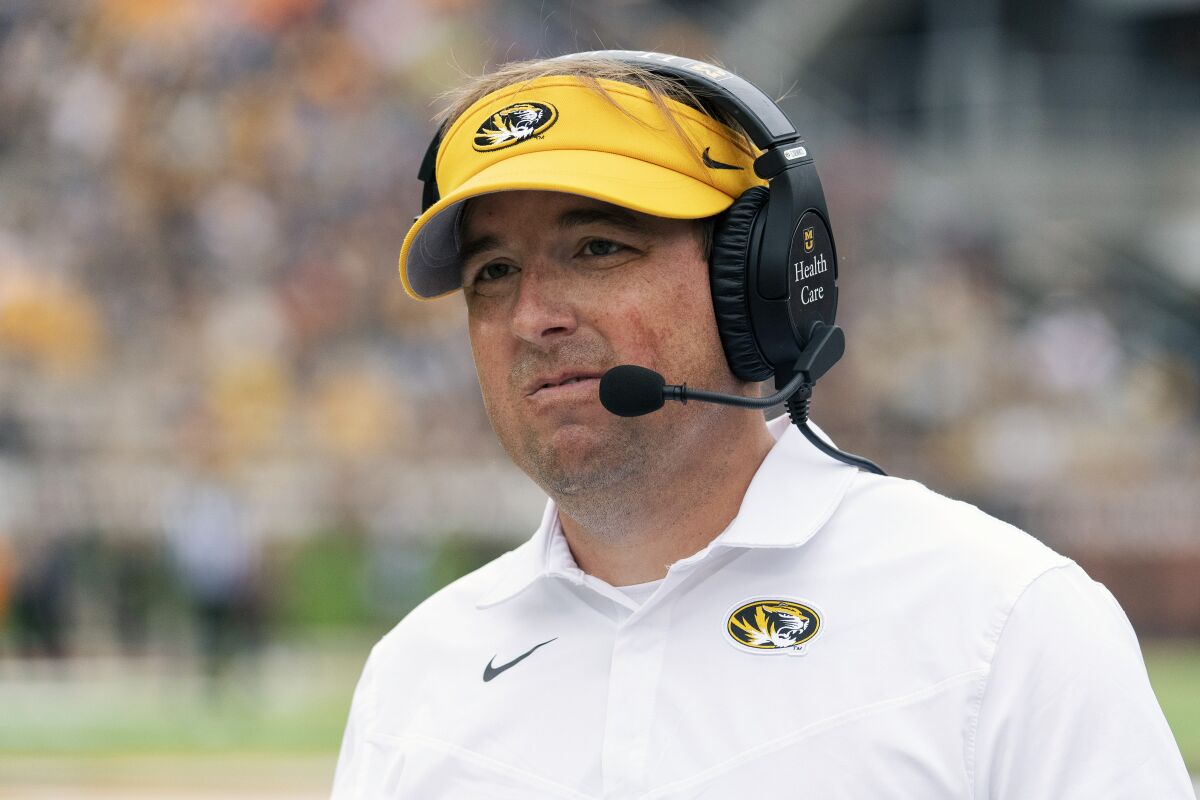 Missouri head coach Eliah Drinkwitz grimaces as he walks the sideline during the first half of an NCAA college football game against Tennessee Saturday, Oct. 2, 2021, in Columbia, Mo. (AP Photo/L.G. Patterson)