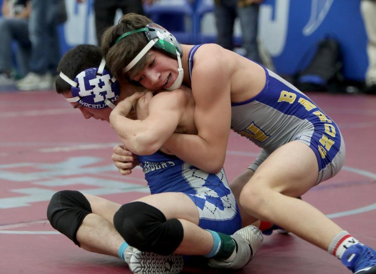 Fountain Valley freshman Zach Parker, top, came in sixth place versus Justin Allred of La Habra in the CIF Southern Section Masters Meet at Cerritos College in Norwalk on Feb. 16. Parker qualified for the CIF State wrestling championships.