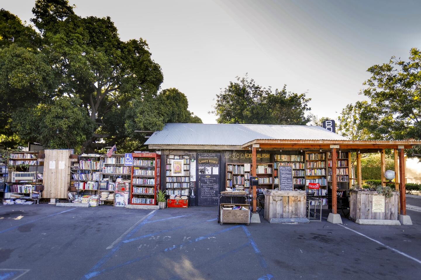 Recently the owner of Lhooq Books, a funky vintage bookstore that has operated in Carlsbad Village for the past 12 years, Sean Christopher received a 60-day eviction notice for both the shop and the adjoining house where he has raised his 10-year-old son, Jack, alone. He's hoping to achieve a stay of eviction on the property long enough to sell off his book inventory and find a new space without going bankrupt and ending up homeless with his son.